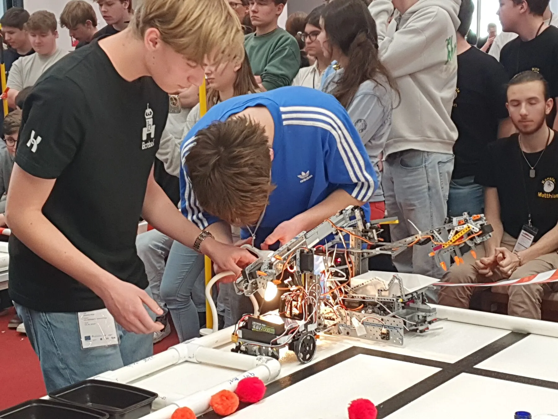 Students working on their robot during the competition